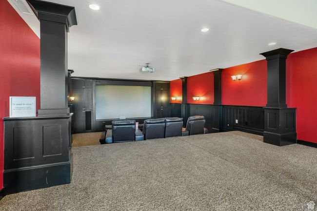 Carpeted cinema featuring a wainscoted wall, visible vents, and recessed lighting | Image 5
