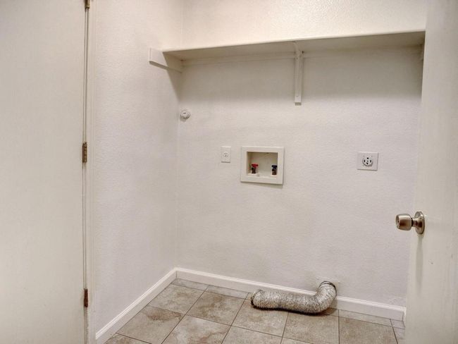 Utility room accessible from the garage. | Image 28