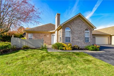 View of front of property with a front lawn and a garage | Image 1