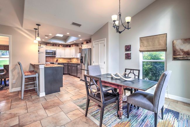 Kitchen Dining area featuring recessed lighting, an inviting chandelier and stone finish floor | Image 18