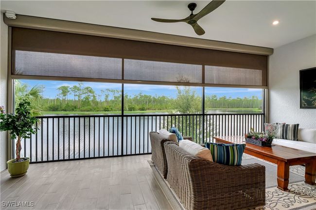 Lanai with wide lake and preserve views | Image 26