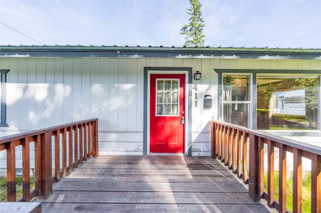 Entrance to property featuring a porch and metal roof | Image 26