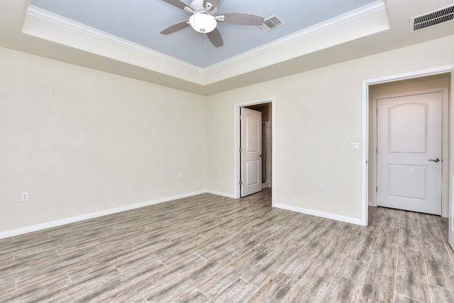 Primary Bedroom has the wood-look tile for easy keeping. | Image 19