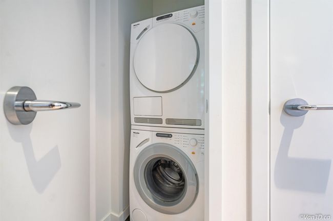 Laundry room with stacked washer / dryer | Image 8