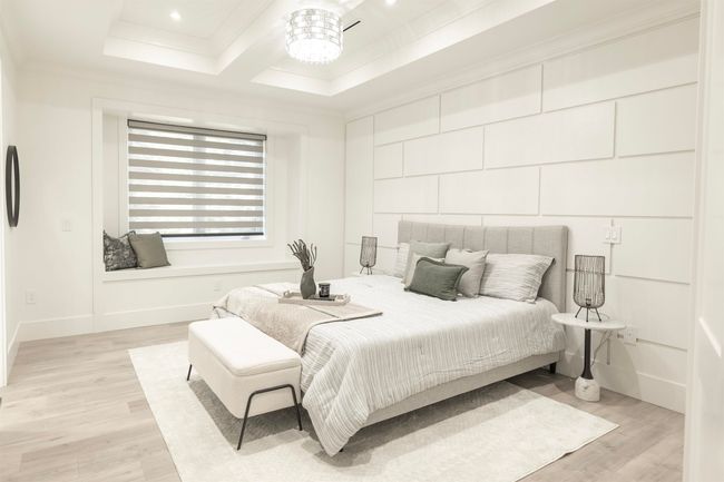 Bedroom with crown molding, light wood finished floors, baseboards, and recessed lighting | Image 13