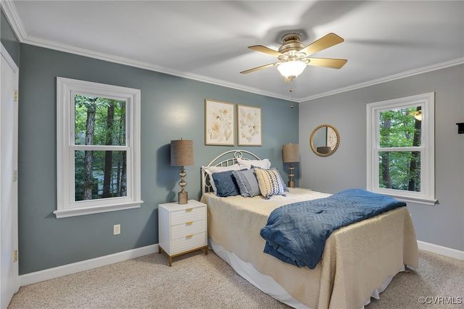 Carpeted bedroom featuring crown molding and ceiling fan | Image 21