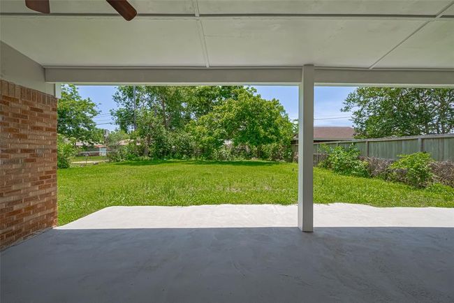 From the patio, enjoy a view of the lush backyard — a peaceful and private extension of your living space. | Image 29