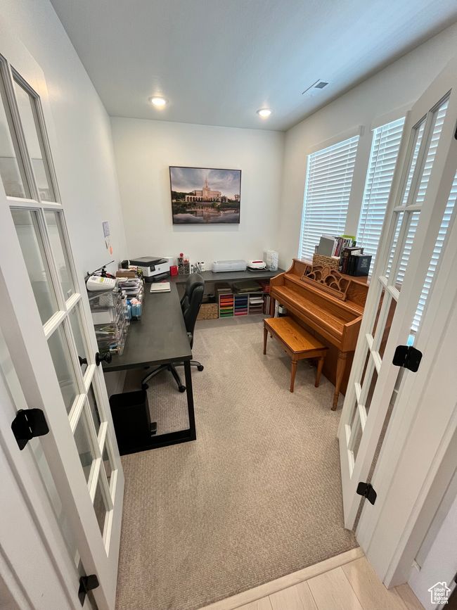 Carpeted office with french doors and recessed lighting | Image 5