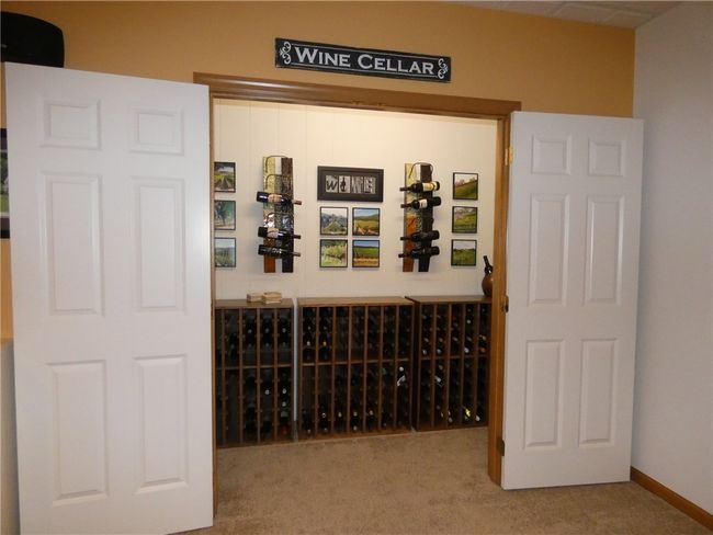 Adjacent to the open floor plan game room is your very own space for a wine cellar! | Image 39