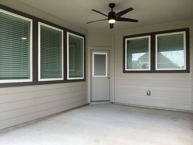 View of patio / terrace with a ceiling fan | Image 32