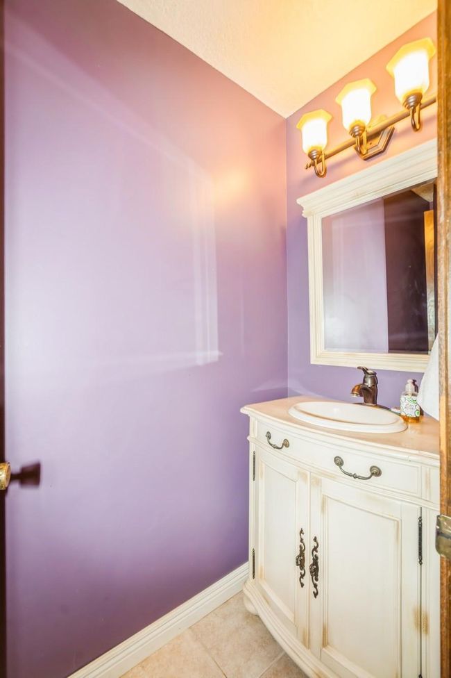 Just off the living room is a 1/2 bathroom with tile flooring! | Image 35