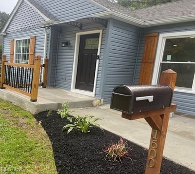 Doorway to property with a patio area | Image 2