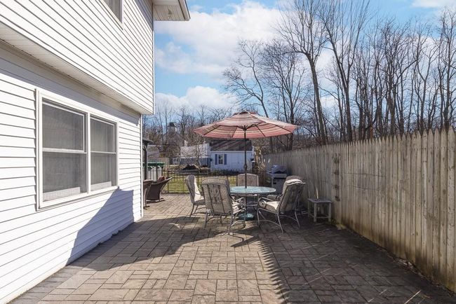 View of patio / terrace with outdoor dining area and a fenced backyard | Image 19