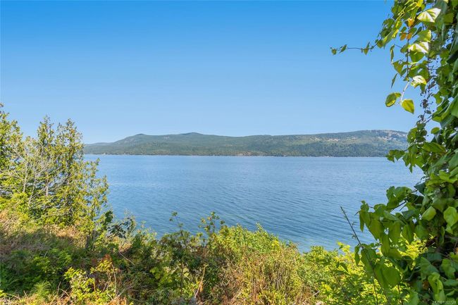 Water view with a mountain backdrop | Image 65