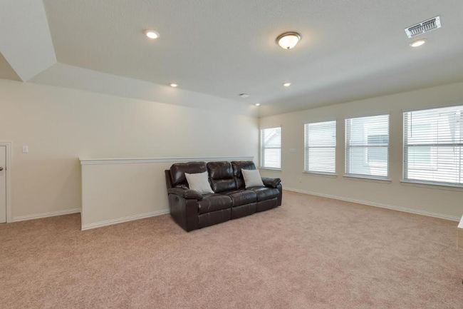 Living area featuring carpet flooring, baseboards, and recessed lighting | Image 30