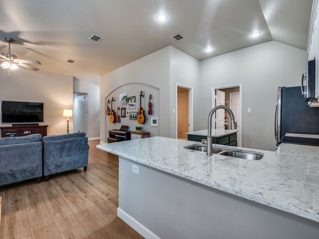 Kitchen featuring a breakfast bar | Image 8