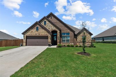 View of front of house with a front yard and a garage | Image 2