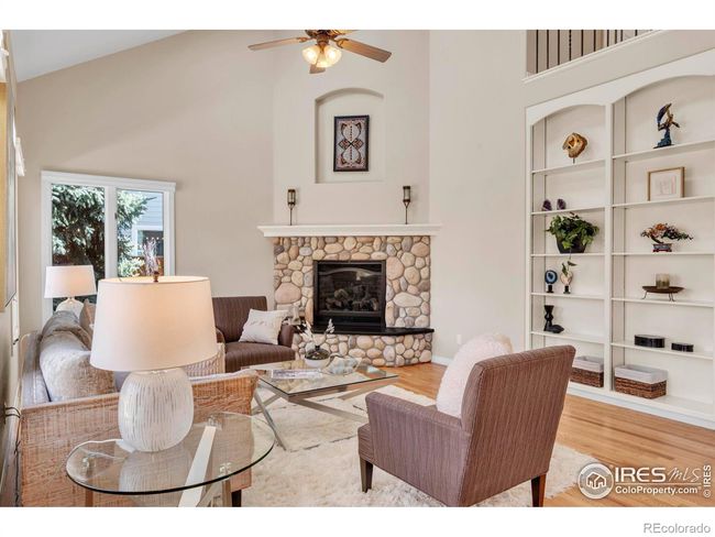 Family room features gas fireplace & custom built in shelving. | Image 15