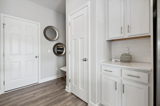 (Photo of decorated model, actual home's finishes will vary) A warm welcome to the home, this owner's entry is located near the entry closet and offers quick access to the kitchen. Plus, there is enough space for a bench, cubbies and coat hooks. | Image 11