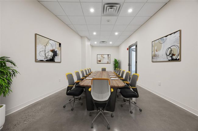 Dining room with baseboards, recessed lighting, and finished concrete flooring | Image 9