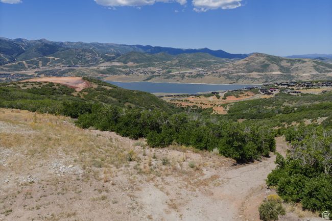 Mountain view with a large body of water | Image 12