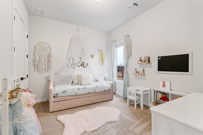 Carpeted bedroom featuring baseboards | Image 27