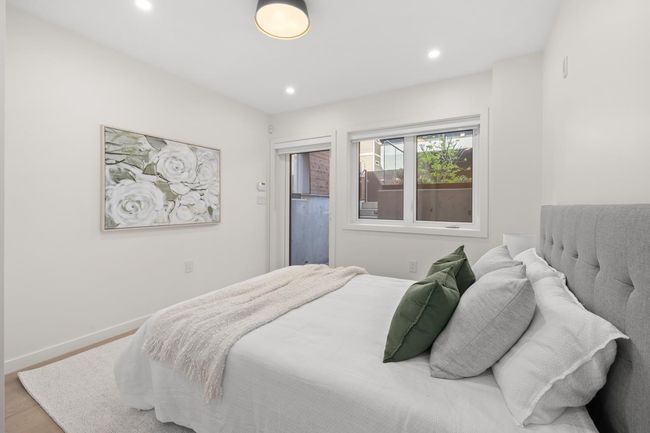 Bedroom with baseboards, wood finished floors, and recessed lighting | Image 12
