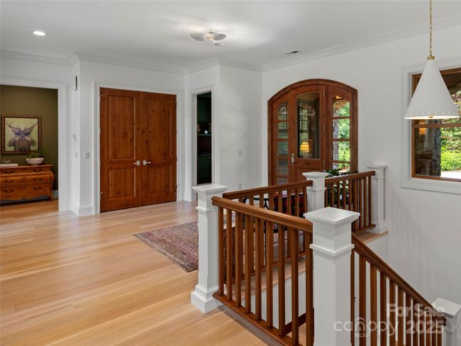 Large, welcoming entry with lots of light. White oak wide-plank hardwood flooring. | Image 5