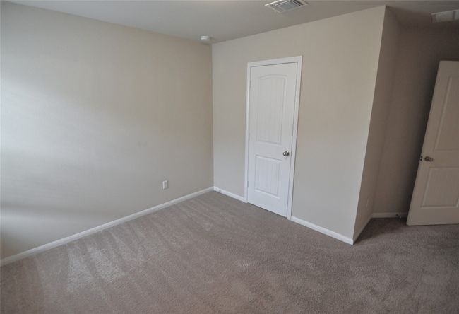 Unfurnished room featuring visible vents, carpet floors, and baseboards | Image 10