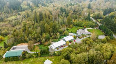 This private estate features over 20, 000 square feet of total building space. Beyond your private 10 acres, is an additional 40 acres of county-owned protected land, preventing future development. Just imagine all this tranquility, while being just 4 miles from downtown Woodinville and only 20 min to Bellevue. | Image 2