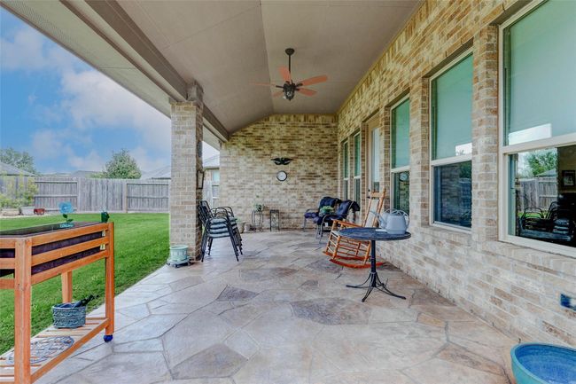 Step outside to your privateoasis, where a spacious coveredpatio sets the stage for outdoorrelaxation and entertaining.Picture yourself adding a cozysectional and a dining table for alfresco meals or casual lounging. | Image 24