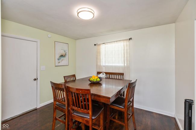 dining room featuring wood finished floors and baseboards | Image 12