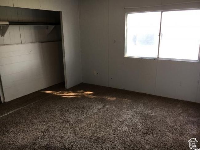Unfurnished bedroom featuring carpet floors and a closet | Image 43