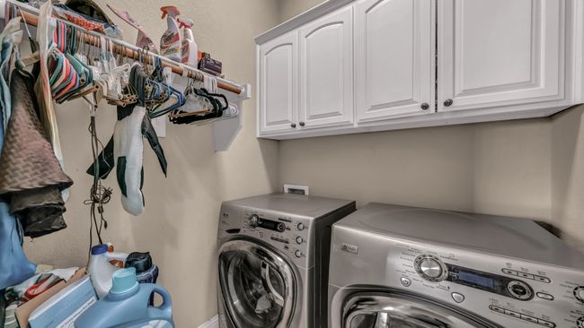 Laundry room featuring separate washer and dryer and cabinet space | Image 28