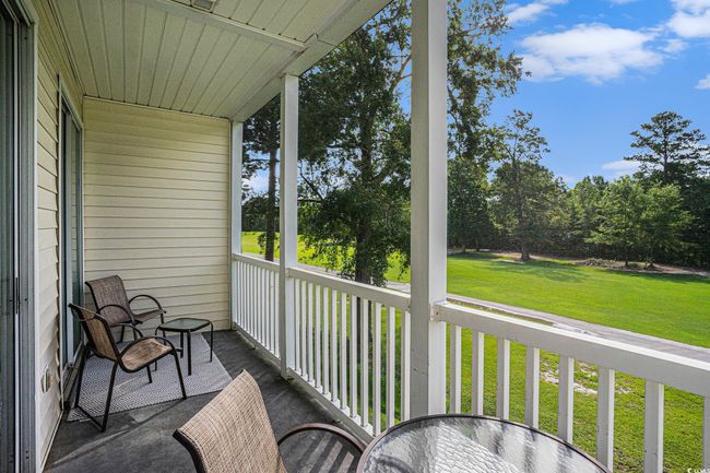 Sunroom / solarium featuring view of scattered trees | Image 20