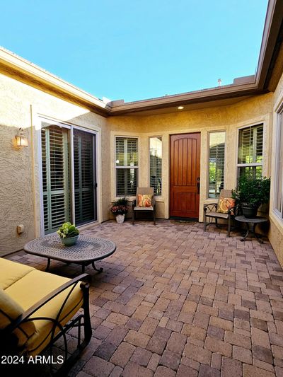 Enjoy your morning coffee or evening wine in the large courtyard. Rain gutters protect the courtyard form a mess. | Image 3