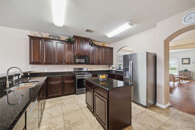 Kitchen with island and gas stove! | Image 8