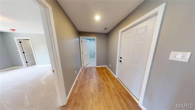 Corridor featuring baseboards and light wood finished floors | Image 23