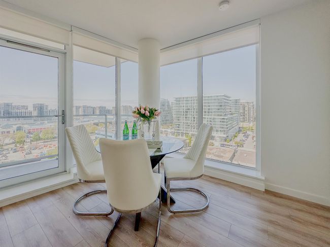 Dining space with a city view and wood finished floors | Image 8
