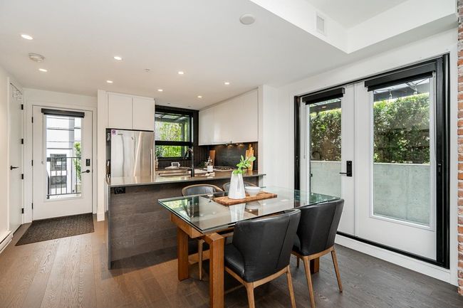 Dining room featuring dark wood finished floors and recessed lighting | Image 8