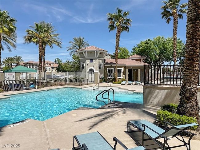 Community pool with a patio and fence | Image 34