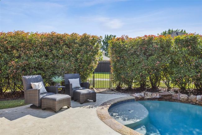 View of pool featuring a patio area | Image 33