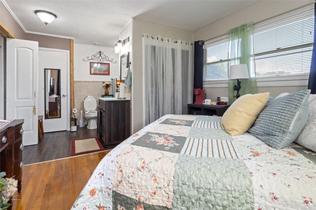 Bedroom featuring wood finished floors | Image 13