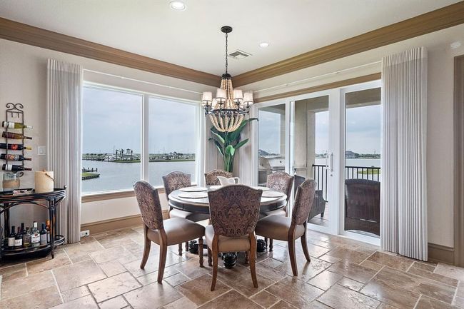 The dining area offers captivating views of Harborwalk Marina and the Marina Channel | Image 10