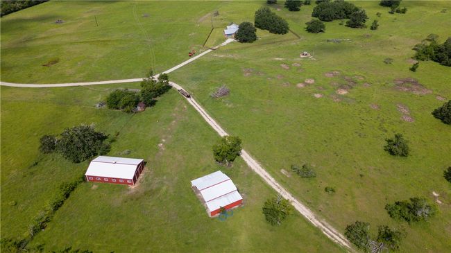 Aerial view of property and surrounding area featuring rural landscape and agricultural land | Image 12