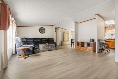 vaulted great room with new lvt flooring | Image 3