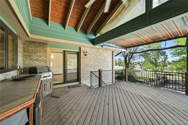 Covered patio with built in kitchen off of the kitchen/living room | Image 26