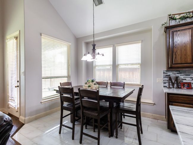 The breakfast area is perfectly positioned with a window seat and direct access to the backyard. | Image 14