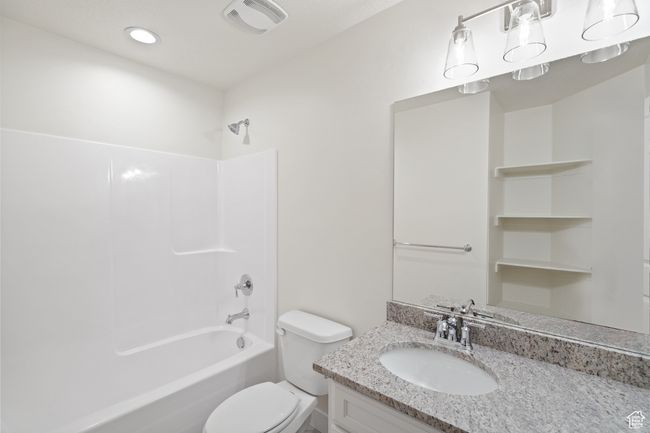 Bathroom with tub / shower combination and vanity | Image 16