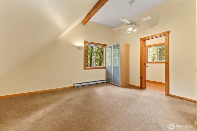 Upstairs primary bedroom with private half bath | Image 32